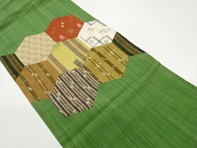 Handwoven tsumugi tsumugi Nagoya obi with geometric and kasuri patterns in kurim